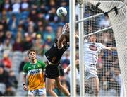 30 March 2025; Offaly goalkeeper Paddy Dunican loses possession as he's tackled by Niall Kelly of Kildare in the build-up to Kildare's first goal, scored by Harry O'Neill, not pictured, during the Allianz Football League Division 3 final match between Kildare and Offaly at Croke Park in Dublin. Photo by Piaras Ó Mídheach/Sportsfile