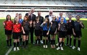 30 March 2025; Uachtarán Chumann Lúthchleas Gael Jarlath Burns with Brian Kelly of Allianz Ireland and referee David Gough, and Dublin Primary Whistlers  Daire Prunty, Ciara Slator, Kate Ryan, Isobel Keaveney, Beibhinn Stanley, Lilybeth Ramsay, Marcus McCracken, Brandon Kelly, Ruby Foley, Claire  Buckley, Aoife  Buckley, Aodhán Rodgers during half-time of the Allianz Football League Division 1 Final match between Kerry and Mayo at Croke Park in Dublin. Photo by Ray McManus/Sportsfile