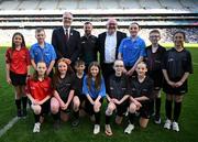 30 March 2025; Uachtarán Chumann Lúthchleas Gael Jarlath Burns with Brian Kelly of Allianz Ireland and referee David Gough, and Dublin Primary Whistlers  Daire Prunty, Ciara Slator, Kate Ryan, Isobel Keaveney, Beibhinn Stanley, Lilybeth Ramsay, Marcus McCracken, Brandon Kelly, Ruby Foley, Claire  Buckley, Aoife  Buckley, Aodhán Rodgers during half-time of the Allianz Football League Division 1 Final match between Kerry and Mayo at Croke Park in Dublin. Photo by Ray McManus/Sportsfile
