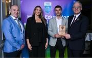 31 March 2025; DCU Dóchas Éireann player Ciarán Caulfield, centre, is presented with the Electric Ireland Higher Education GAA Football Rising Stars Player of the Year award by, from left, Higher Education GAA Chairperson Benny Hurl, Electric Ireland Sponsorship Manager Sarah Gelletlie and Uachtarán Chumann Lúthchleas Gael Jarlath Burns during the Electric Ireland Higher Education Rising Stars Awards at Castleknock Hotel in Dublin. Photo by Shauna Clinton/Sportsfile