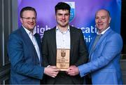31 March 2025; DCU Dóchas Éireann player Cian Boran, centre, is presented with his 2025 Electric Ireland Higher Education GAA Hurling Rising Stars Team of the Year award by Electric Ireland Group Sponsorship & PR Manager Rob Crabbe, left, and Higher Education GAA Chairperson Benny Hurl during the Electric Ireland Higher Education Rising Stars Awards at Castleknock Hotel in Dublin. Photo by Shauna Clinton/Sportsfile