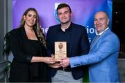 31 March 2025; University College Dublin player Killian Roche, centre, is presented with his 2025 Electric Ireland Higher Education GAA Football Rising Stars Team of the Year award by Electric Ireland Sponsorship Manager Sarah Gelletlie, left, and Higher Education GAA Chairperson Benny Hurl during the Electric Ireland Higher Education Rising Stars Awards at Castleknock Hotel in Dublin. Photo by Shauna Clinton/Sportsfile