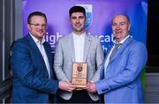 31 March 2025; University of Limerick player Darach Fahy, centre, is presented with his 2025 Electric Ireland Higher Education GAA Hurling Rising Stars Team of the Year award by Electric Ireland Group Sponsorship & PR Manager Rob Crabbe, left, and Higher Education GAA Chairperson Benny Hurl during the Electric Ireland Higher Education Rising Stars Awards at Castleknock Hotel in Dublin. Photo by Shauna Clinton/Sportsfile