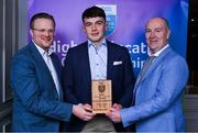 31 March 2025; DCU Dóchas Éireann player Paddy Langton, centre, is presented with his 2025 Electric Ireland Higher Education GAA Hurling Rising Stars Team of the Year award by Electric Ireland Group Sponsorship & PR Manager Rob Crabbe, left, and Higher Education GAA Chairperson Benny Hurl during the Electric Ireland Higher Education Rising Stars Awards at Castleknock Hotel in Dublin. Photo by Shauna Clinton/Sportsfile