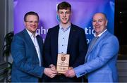 31 March 2025; DCU Dóchas Éireann player Padraic Moylan, centre, is presented with his 2025 Electric Ireland Higher Education GAA Hurling Rising Stars Team of the Year award by Electric Ireland Group Sponsorship & PR Manager Rob Crabbe, left, and Higher Education GAA Chairperson Benny Hurl during the Electric Ireland Higher Education Rising Stars Awards at Castleknock Hotel in Dublin. Photo by Shauna Clinton/Sportsfile