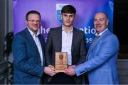 31 March 2025; DCU Dóchas Éireann player Donal Shirley, centre, is presented with his 2025 Electric Ireland Higher Education GAA Hurling Rising Stars Team of the Year award by Electric Ireland Group Sponsorship & PR Manager Rob Crabbe, left, and Higher Education GAA Chairperson Benny Hurl during the Electric Ireland Higher Education Rising Stars Awards at Castleknock Hotel in Dublin. Photo by Shauna Clinton/Sportsfile