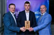 31 March 2025; Garda College player Daire O'Leary, centre, is presented with his 2025 Electric Ireland Higher Education GAA Hurling Rising Stars Team of the Year award by Electric Ireland Group Sponsorship & PR Manager Rob Crabbe, left, and Higher Education GAA Chairperson Benny Hurl during the Electric Ireland Higher Education Rising Stars Awards at Castleknock Hotel in Dublin. Photo by Shauna Clinton/Sportsfile