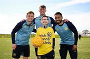 2 April 2025; All in Against Cancer: St Patrick's Athletic superfan Caiden Molloy, centre, meets heroes, from left, Brandon Kavanagh, Chris Forrester and Jake Mulraney to mark Daffodil Day. To support the Irish Cancer Society’s free supports and service, please donate at cancer.ie/daffodilday. Photo by Sam Barnes/Sportsfile