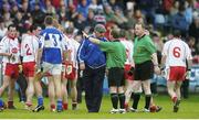 8 July 2006; Laois manager Mick O'Dwyer remonstraies with referee John Geaney, under the watchful eye of linesman Peter O'Reilly, before the teams leave the field at half-time. Bank of Ireland All-Ireland Senior Football Championship Qualifier, Round 2, Laois v Tyrone, O'Moore Park, Portlaoise, Co. Laois. Picture credit: Brendan Moran / SPORTSFILE