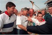 30 August 1998; Kildare manager Mick O'Dwyer celebrates with supporters after the Bank of Ireland All-Ireland Senior Football Championship Semi-Final match between Kerry and Kildare at Croke Park in Dublin. Photo by Brendan Moran/Sportsfile