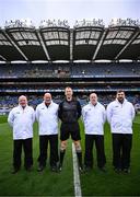 29 March 2025; Referee Seamus Mulhare and his officials, line umpires Fergal Kelly and Andrew Smith, sideline official Paddy McDermott, and score umpires Phil Keogh, Séamus Lalor, Chris Grehan and Ger Keane, before the Allianz Football League Division 4 final match between Wexford and Limerick at Croke Park in Dublin. Photo by Ramsey Cardy/Sportsfile