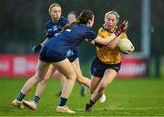 13 March 2025; Aobha Harmon of DCU Dóchas Éireann in action against Brenna O Neill of TUD during the 2025 AIG Moynihan Cup final match between TUD CC1 and DCU Dóchas Éireann at Queen's Sport in Belfast. Photo by Shauna Clinton/Sportsfile