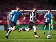 5 April 2025; Ben Fitzgerald of Midleton FC in action against Jamie Brennan of Belvedere FC during the FAI Under 17 Cup final match between Midleton FC and Belvedere FC at Turners Cross Stadium in Cork. Photo by Michael P Ryan/Sportsfile