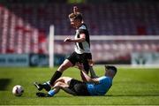 5 April 2025; Dara Birdthistle of Midleton FC is tackled by Jamie Brennan of Belvedere FC during the FAI Under 17 Cup final match between Midleton FC and Belvedere FC at Turners Cross Stadium in Cork. Photo by Michael P Ryan/Sportsfile