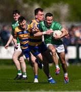 5 April 2025; Eoin Walsh of London is tackled by Enda Smith of Roscommon during the Connacht GAA Football Senior Championship quarter-final match between London and Roscommon at McGovern Park in Ruislip, England. Photo by Ben McShane/Sportsfile