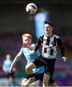5 April 2025; Sean Og Madden of Midleton FC in action against Lewis Bruton of Belvedere FC during the FAI Under 17 Cup final match between Midleton FC and Belvedere FC at Turners Cross Stadium in Cork. Photo by Michael P Ryan/Sportsfile