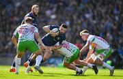 5 April 2025; Robbie Henshaw of Leinster is tackled by Fin Baxter of Harlequins during the Investec Champions Cup Round of 16 match between Leinster and Harlequins at Croke Park in Dublin. Photo by Brendan Moran/Sportsfile