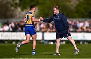 5 April 2025; Enda Smith of Roscommon is greated by Roscommon manager Davy Burke as he is substituted off during the Connacht GAA Football Senior Championship quarter-final match between London and Roscommon at McGovern Park in Ruislip, England. Photo by Ben McShane/Sportsfile
