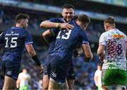 5 April 2025; Robbie Henshaw of Leinster contratulates teammate Garry Ringrose, 13, on scoring their side's fifth try during the Investec Champions Cup Round of 16 match between Leinster and Harlequins at Croke Park in Dublin. Photo by Brendan Moran/Sportsfile