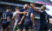 5 April 2025; Robbie Henshaw of Leinster, left, and Jamison Gibson-Park contratulate teammate Garry Ringrose on scoring their side's fifth try during the Investec Champions Cup Round of 16 match between Leinster and Harlequins at Croke Park in Dublin. Photo by Brendan Moran/Sportsfile