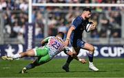 5 April 2025; Robbie Henshaw of Leinster evades the tackle of Luke Northmore of Harlequins during the Investec Champions Cup Round of 16 match between Leinster and Harlequins at Croke Park in Dublin. Photo by Sam Barnes/Sportsfile