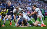 5 April 2025; Ross Byrne of Leinster scores his side's eighth try despite the efforts of Jamie Benson of Harlequins during the Investec Champions Cup Round of 16 match between Leinster and Harlequins at Croke Park in Dublin. Photo by Sam Barnes/Sportsfile