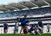 5 April 2025; Ross Byrne of Leinster celebrates with teammates Jamie Osborne and Jordie Barrett after scoring his side's eighth try during the Investec Champions Cup Round of 16 match between Leinster and Harlequins at Croke Park in Dublin. Photo by Sam Barnes/Sportsfile