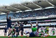 5 April 2025; Ross Byrne of Leinster, hidden, scores his side's eighth try despite the efforts of Jamie Benson of Harlequins, 22, during the Investec Champions Cup Round of 16 match between Leinster and Harlequins at Croke Park in Dublin. Photo by Sam Barnes/Sportsfile