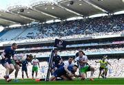 5 April 2025; Ross Byrne of Leinster scores his side's eighth try despite the efforts of Jamie Benson of Harlequins during the Investec Champions Cup Round of 16 match between Leinster and Harlequins at Croke Park in Dublin. Photo by Sam Barnes/Sportsfile
