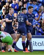 5 April 2025; Ross Byrne of Leinster, 22, is congratulated by teammates Jamie Osborne and Jordie Barrett after scoring their side's eighth try during the Investec Champions Cup Round of 16 match between Leinster and Harlequins at Croke Park in Dublin. Photo by Brendan Moran/Sportsfile