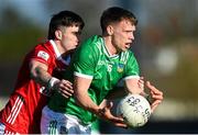 5 April 2025; Cillian Fahy of Limerick is tackled by Chris Óg Jones of Cork during the Munster GAA Football Senior Championship quarter-final match between Limerick and Cork at TUS Gaelic Grounds in Limerick. Photo by Tom Beary/Sportsfile