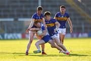 5 April 2025; Jamie Power of Waterford is tackled by Paudie Feehan and Darragh Brennan of Tipperary during the Munster GAA Football Senior Championship quarter-final match between Tipperary and Waterford at FBD Semple Stadium in Thurles, Tipperary. Photo by David Ribeiro/Sportsfile