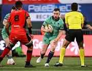 5 April 2025; JJ Hanrahan of Connacht squeezes past referee Luc Ramos during the EPCR Challenge Cup Round of 16 match between Connacht and Cardiff Rugby at Dexcom Stadium in Galway. Photo by Piaras Ó Mídheach/Sportsfile