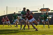 5 April 2025; Colm O'Callaghan of Cork is tackled by Iain Corbett of Limerick during the Munster GAA Football Senior Championship quarter-final match between Limerick and Cork at TUS Gaelic Grounds in Limerick. Photo by Tom Beary/Sportsfile