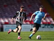 5 April 2025; Ben Fitzgerald of Midleton FC in action against Jamie Brennan of Belvedere FC during the FAI Under 17 Cup final match between Midleton FC and Belvedere FC at Turners Cross Stadium in Cork. Photo by Michael P Ryan/Sportsfile