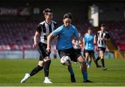 5 April 2025; Jamie Brennan of Belvedere FC in action against James O'Meara of Midleton FC during the FAI Under 17 Cup final match between Midleton FC and Belvedere FC at Turners Cross Stadium in Cork. Photo by Michael P Ryan/Sportsfile
