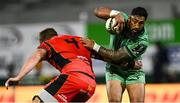 5 April 2025; Bundee Aki of Connacht in action against Josh McNally of Cardiff Rugby during the EPCR Challenge Cup Round of 16 match between Connacht and Cardiff Rugby at Dexcom Stadium in Galway. Photo by Piaras Ó Mídheach/Sportsfile