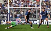 5 April 2025; Robbie Henshaw of Leinster evades the tackle of Luke Northmore of Harlequins during the Investec Champions Cup Round of 16 match between Leinster and Harlequins at Croke Park in Dublin. Photo by Sam Barnes/Sportsfile