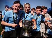 5 April 2025; Belvedere FC players from left, Jamie Brennan, Rudy Flood and Bobby Doyle celebrate with the cup after the FAI Under 17 Cup final match between Midleton FC and Belvedere FC at Turners Cross Stadium in Cork. Photo by Michael P Ryan/Sportsfile