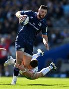 5 April 2025; Robbie Henshaw of Leinster is tackled by Ben Waghorn of Harlequins during the Investec Champions Cup Round of 16 match between Leinster and Harlequins at Croke Park in Dublin. Photo by Brendan Moran/Sportsfile