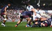 6 April 2025; Tom O'Toole of Ulster scores his side's first try despite the tackle of Ben Tameifuna of Bordeaux Begles during the Investec Champions Cup Round of 16 match between Bordeaux Begles and Ulster at Stade Chaban-Delmas in Bordeaux, France. Photo by Ramsey Cardy/Sportsfile