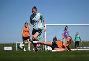 6 April 2025; Aoibheann Clancy is tackled by Heather Payne during a Republic of Ireland women's training session at the FAI National Training Centre in Abbotstown, Dublin. Photo by Stephen McCarthy/Sportsfile