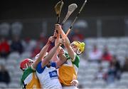6 April 2025; Offaly players Padraig Cantwell, left, and Donal Shirley in action against Waterford players Shane Bennett, front, and Stephen Bennett, hidden, during the Allianz Hurling League Division 1B final match between Waterford and Offaly at SuperValu Páirc Uí Chaoimh in Cork. Photo by Piaras Ó Mídheach/Sportsfile