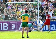 6 April 2025; Donegal goalkeeper Shaun Patton saves the follow up shot from Shane McGuigan of Derry after saving his penalty during the Ulster GAA Football Senior Championship preliminary round match between Donegal and Derry at MacCumhaill Park in Ballybofey, Donegal. Photo by David Fitzgerald/Sportsfile