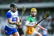 6 April 2025; Darragh Lyons of Waterford  in action against Dan Bourke of Offaly during the Allianz Hurling League Division 1B final match between Waterford and Offaly at SuperValu Páirc Uí Chaoimh in Cork. Photo by Piaras Ó Mídheach/Sportsfile