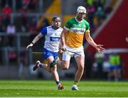 6 April 2025; Oisin Kelly of Offaly in action against Darragh Lyons of Waterford  during the Allianz Hurling League Division 1B final match between Waterford and Offaly at SuperValu Páirc Uí Chaoimh in Cork. Photo by Piaras Ó Mídheach/Sportsfile