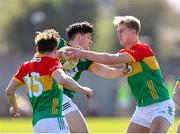 6 April 2025; Seamus Lavin of Meath in action against Conor Crowley, left, and Ross Dunphy of Carlow during the Leinster GAA Football Senior Championship round one match between Meath and Carlow at Pairc Tailteann in Navan, Meath. Photo by Thomas Flinkow/Sportsfile