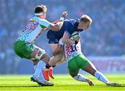 5 April 2025; Jamie Osborne of Leinster is tackled by Harlequins players Marcus Smith and Jack Kenningham during the Investec Champions Cup Round of 16 match between Leinster and Harlequins at Croke Park in Dublin. Photo by Seb Daly/Sportsfile