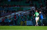 5 April 2025; Sean Clancy of Limerick is consoled by manager Jimmy Lee as he leave the field after receiving a red card during the Munster GAA Football Senior Championship quarter-final match between Limerick and Cork at TUS Gaelic Grounds in Limerick. Photo by Tom Beary/Sportsfile