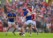6 April 2025; Robert Downey of Cork is tackled by Alan Tynan of Tipperary during the Allianz Hurling League Division 1A final match between Tipperary and Cork at SuperValu Páirc Uí Chaoimh in Cork. Photo by Brendan Moran/Sportsfile